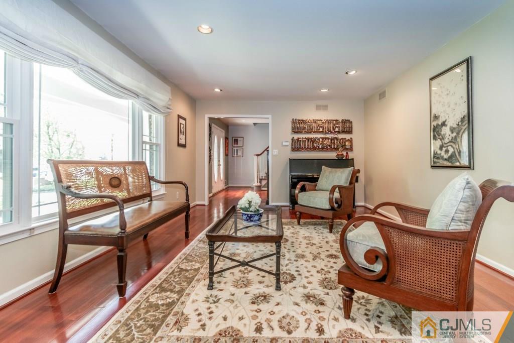 26 Fox Hill Road Edison, NJ 08820 - Photo 5 of 23 a living room with furniture a flat screen tv and next to a window