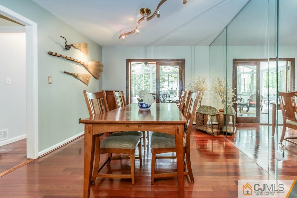 26 Fox Hill Road Edison, NJ 08820 - Photo 6 of 23 a view of a dining room with furniture window and wooden floor