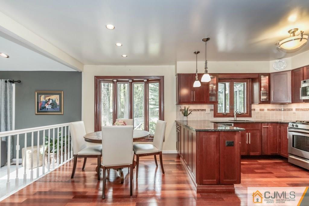 26 Fox Hill Road Edison, NJ 08820 - Photo 8 of 23 a view of a dining room with furniture window and wooden floor