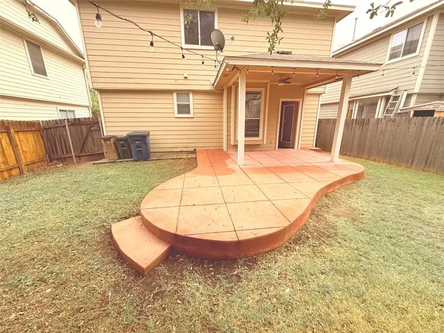 a view of a swimming pool with a yard