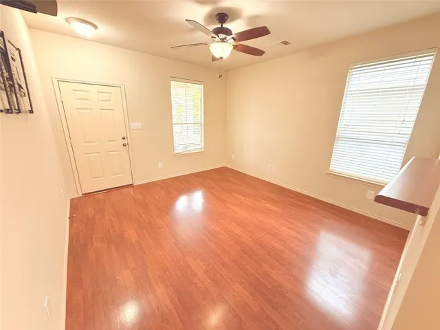 a view of an empty room with a window