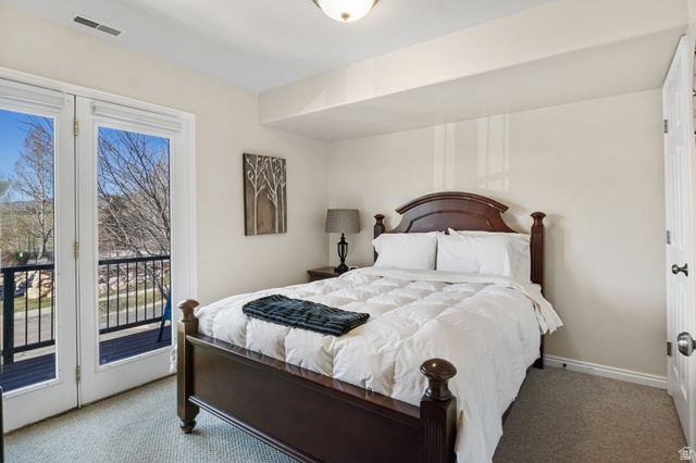 3598 North Huntsman Path, Unit 502 Eden, UT 84310 - Photo 11 of 43 Carpeted bedroom with access to exterior