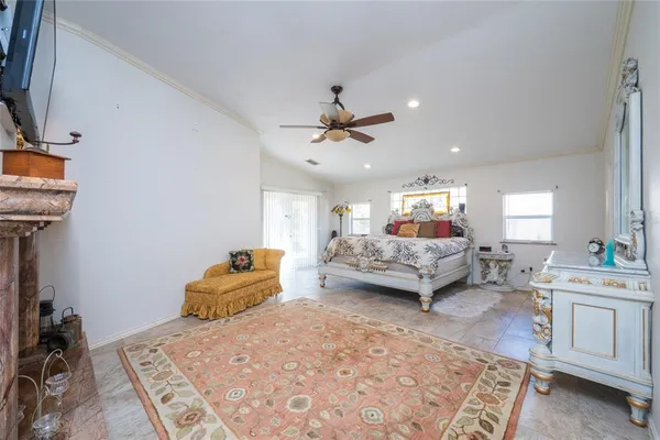 a bedroom with a bed and a couch