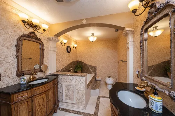 a bathroom with a sink double vanity and a mirror