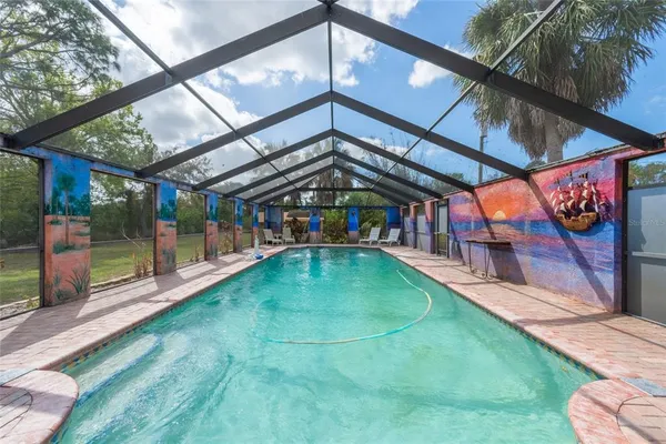 a view of swimming pool with a patio