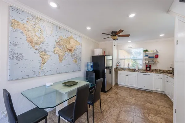 a kitchen with granite countertop a sink stainless steel appliances and cabinets