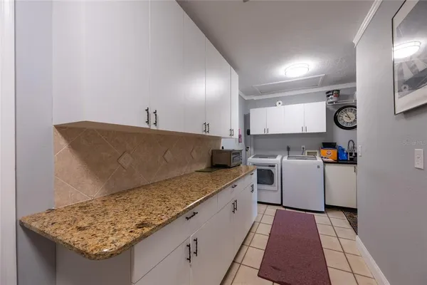 a room with lots of furniture and a large window