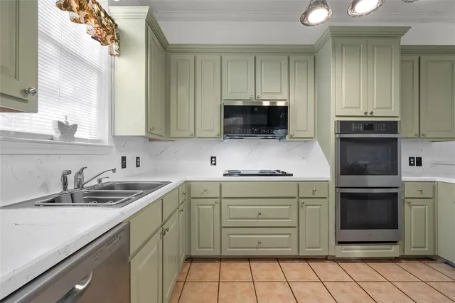 a kitchen with a sink and cabinets