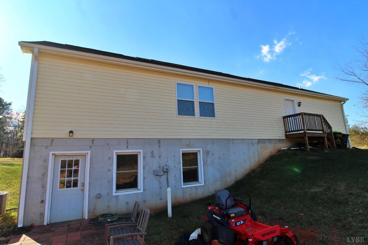 144 Rocky Road Rustburg, VA 24588 - Photo 32 of 34 a front view of a house with a garden