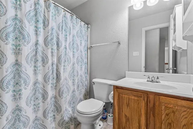 a bathroom with a sink and toilet