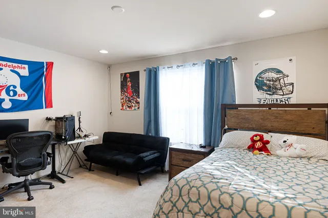 a bedroom with a bed and a couch