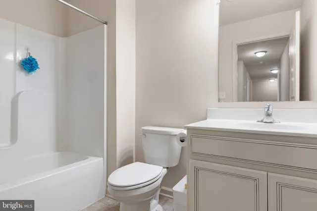 a bathroom with a sink a toilet and a bathtub