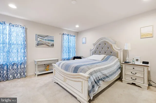 a bed room with a bed and a window