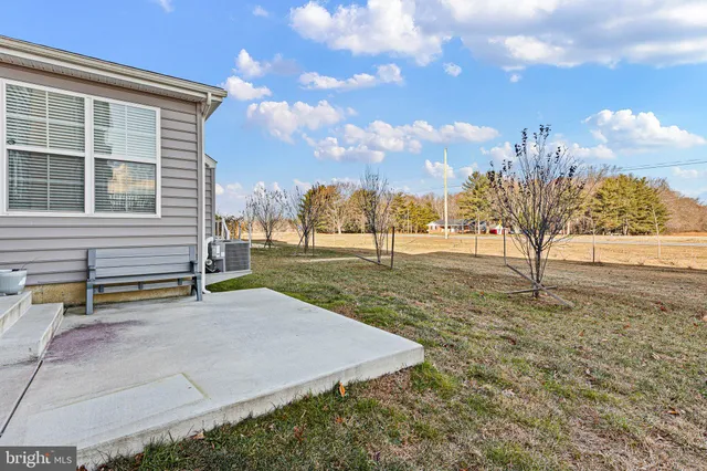 a view of a yard with basketball court