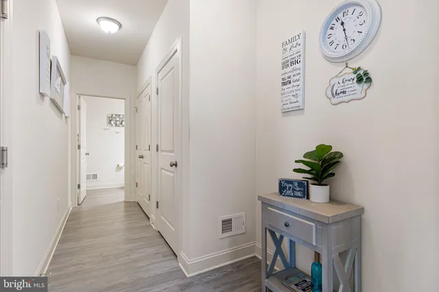 a view of entryway with wooden floor