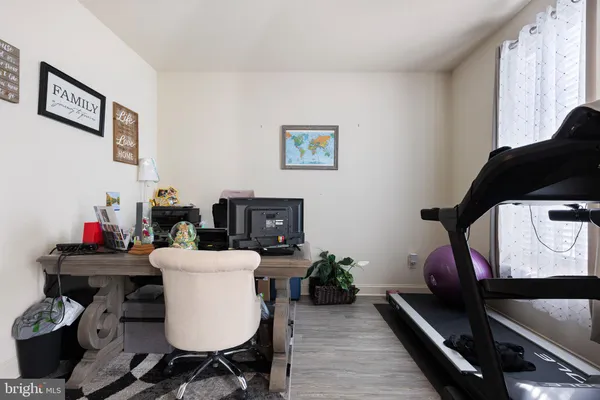 a view of a workspace with furniture and toys