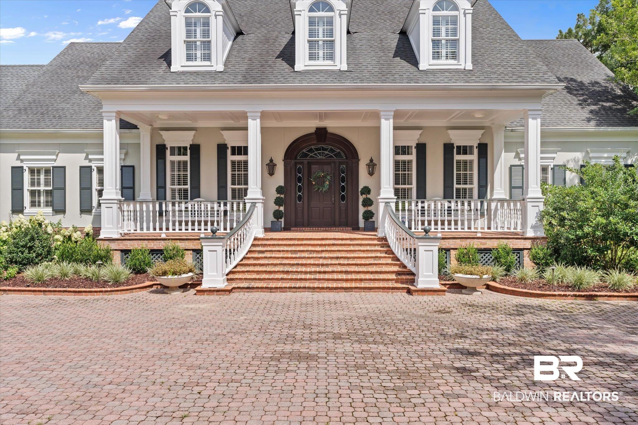 8561 Dawes Lake Road Mobile, AL 36619 - Photo 2 of 63 View of front of home with covered porch, a shingled roof, and stucco siding
