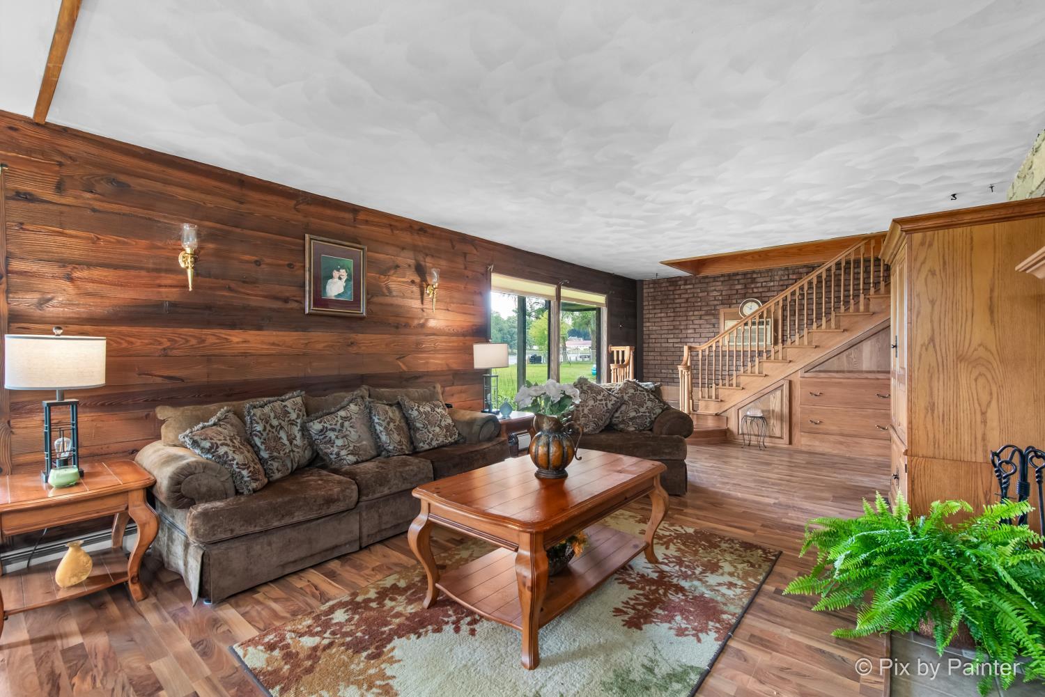 1423 North River Road McHenry, IL 60051 - Photo 20 of 49 a outdoor living space with furniture and a potted plant