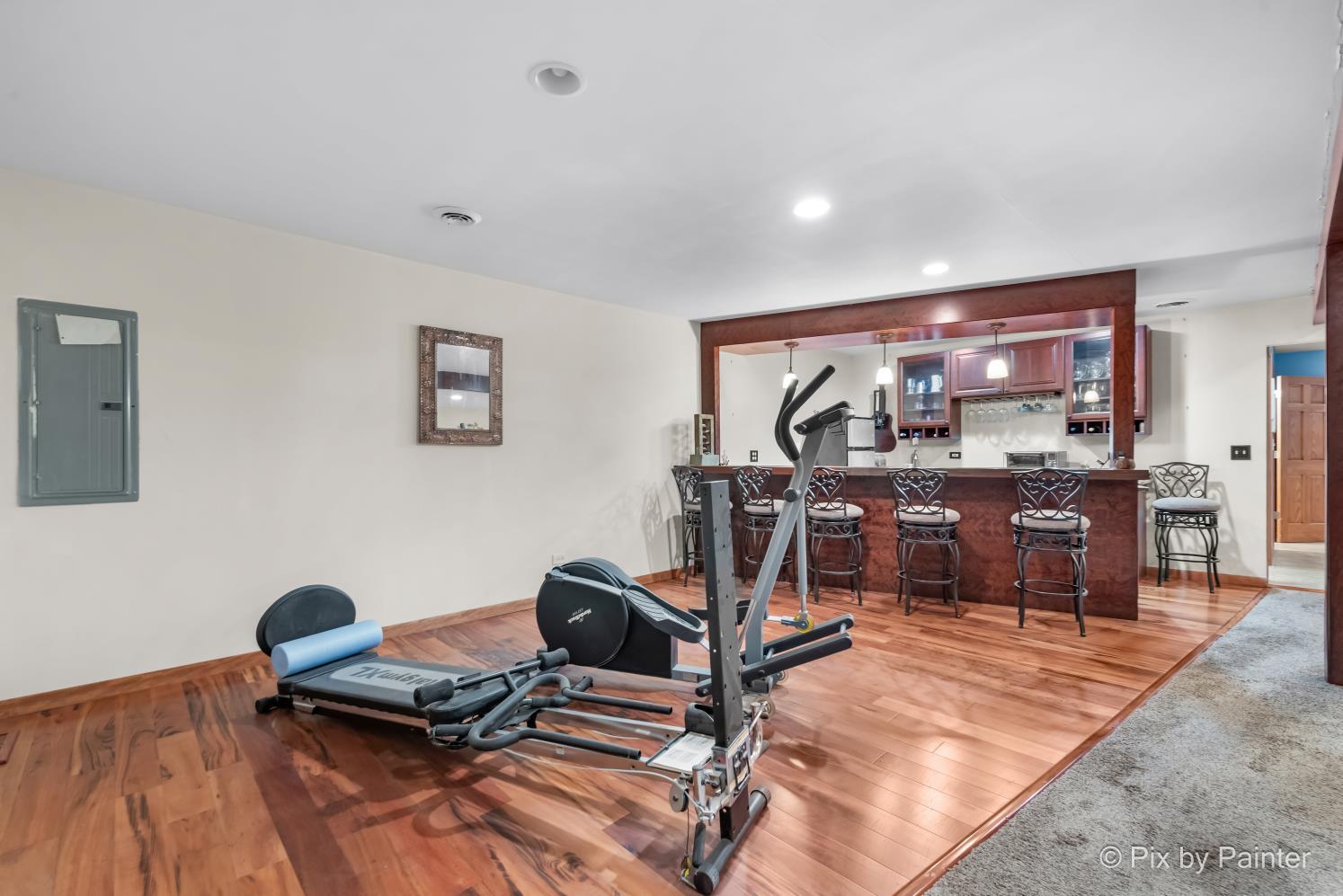 1423 North River Road McHenry, IL 60051 - Photo 30 of 49 a view of a room with gym equipment