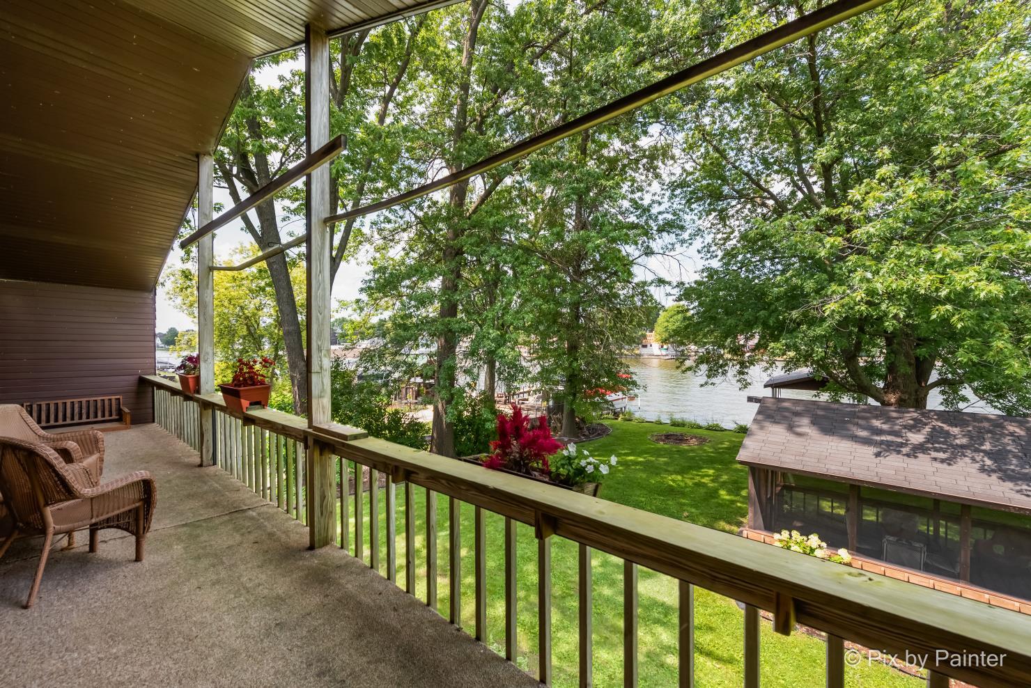 1423 North River Road McHenry, IL 60051 - Photo 37 of 49 a view of a two chair in the balcony