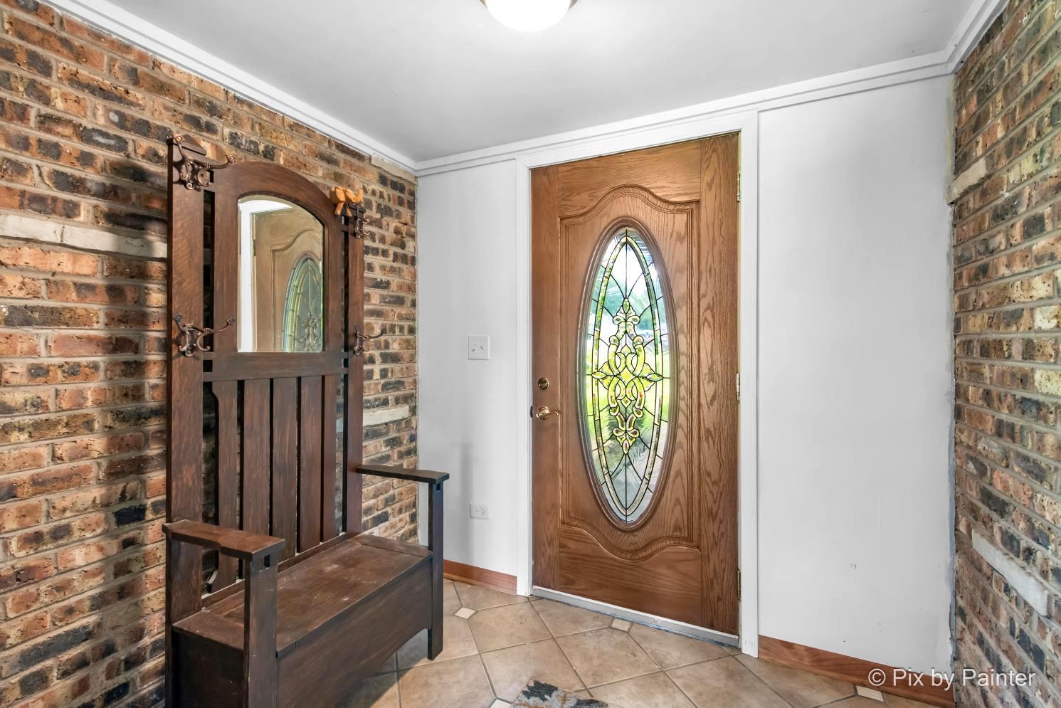 1423 North River Road McHenry, IL 60051 - Photo 6 of 49 wooden floor with a window in a living room