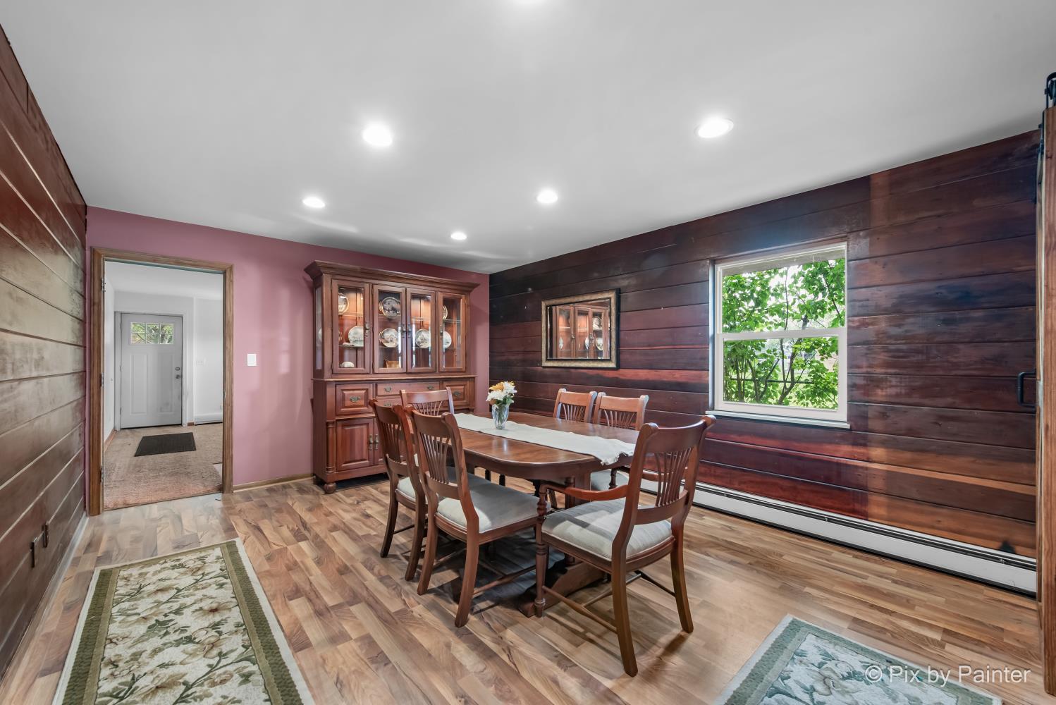 1423 North River Road McHenry, IL 60051 - Photo 10 of 49 a view of a dining room with furniture window and wooden floor
