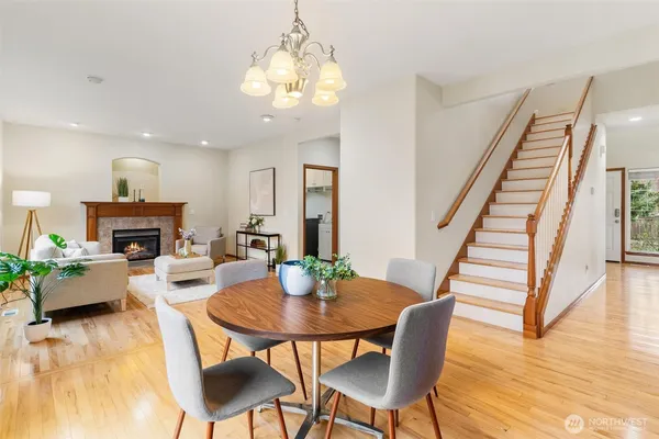 a view of a dining room with furniture and wooden floor