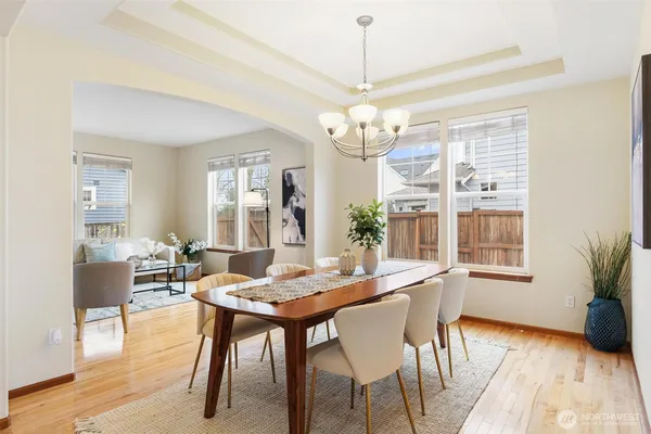 a view of a dining room with furniture window and wooden floor