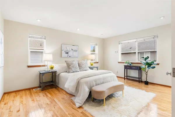 a bedroom with a bed and a table