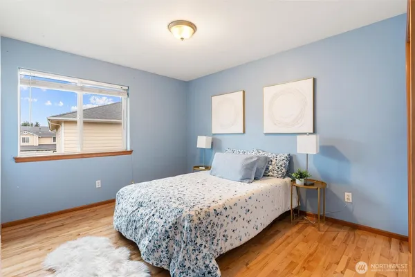 a bedroom with a bed and window