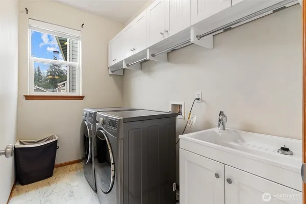 a utility room with cabinets