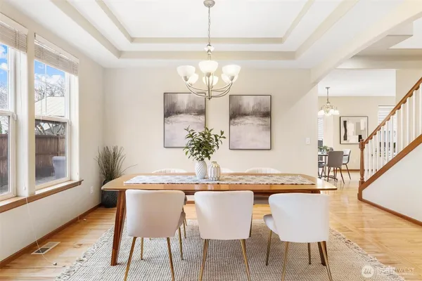 a dining room with furniture and window