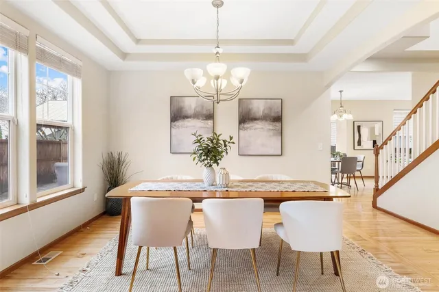 a dining room with furniture and window