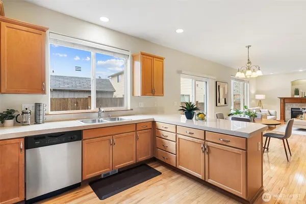 a large kitchen with a sink and cabinets