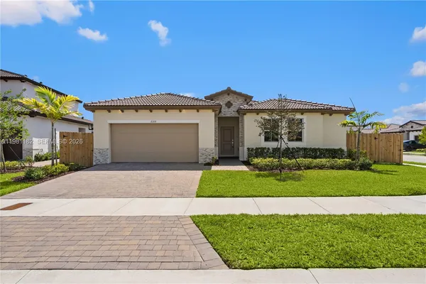 a picture of a bench in front of a wall