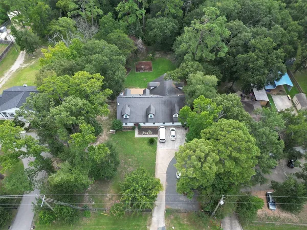 an aerial view of a house with outdoor space and street view