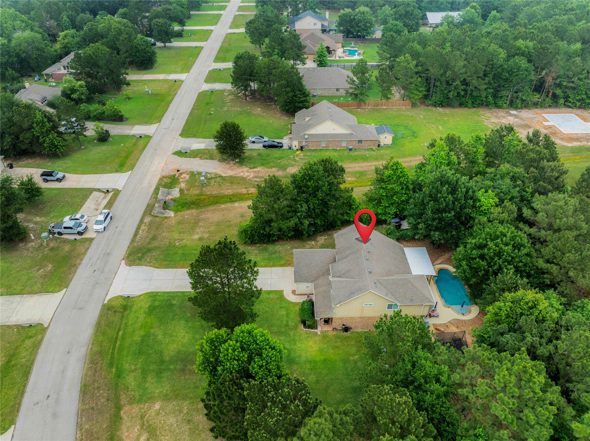9223 Wapiti Trail Conroe, TX 77303 - Photo 2 of 45 an aerial view of house with swimming pool and garden