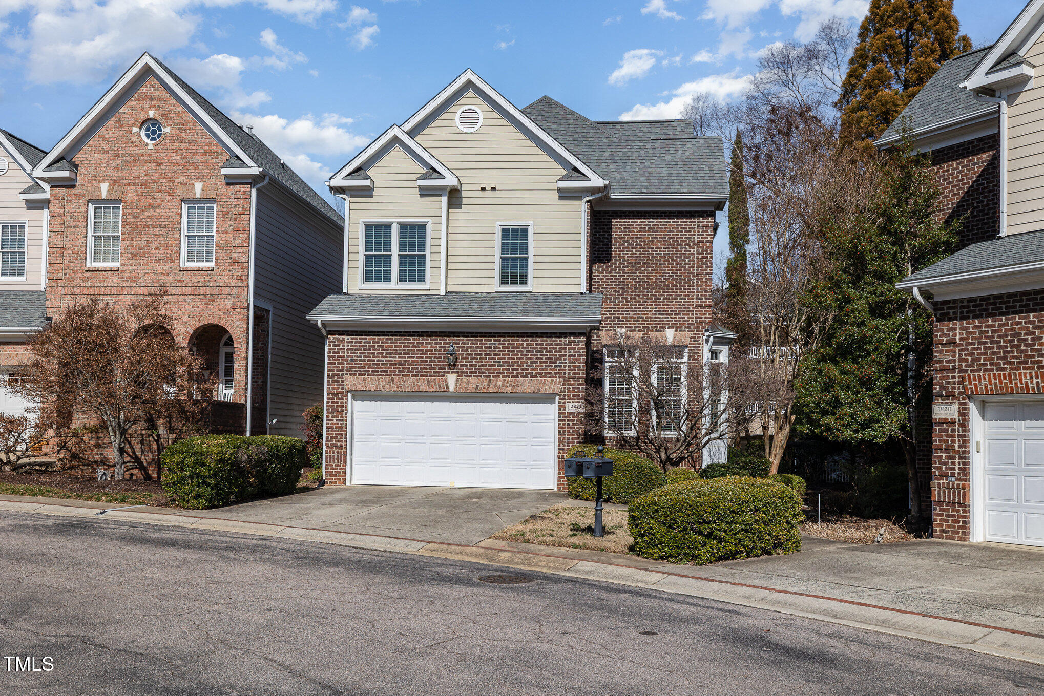 3932 Bentley Bridge Road Raleigh, NC 27612 - Photo 2 of 27 a front view of a house with a yard and garage