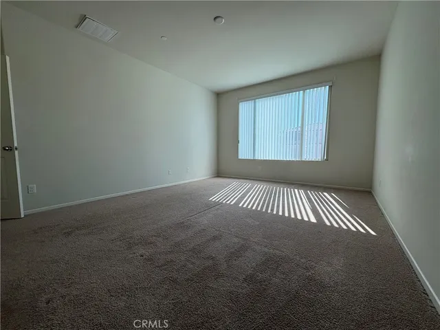a bathroom with a granite countertop sink mirror and a shower