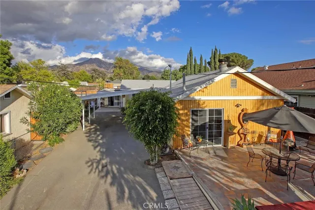 a view of a house with basketball court