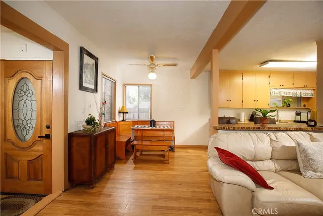a view of a livingroom with furniture and a flat screen tv
