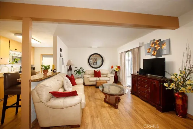 a view of a chairs and table in back yard of the house