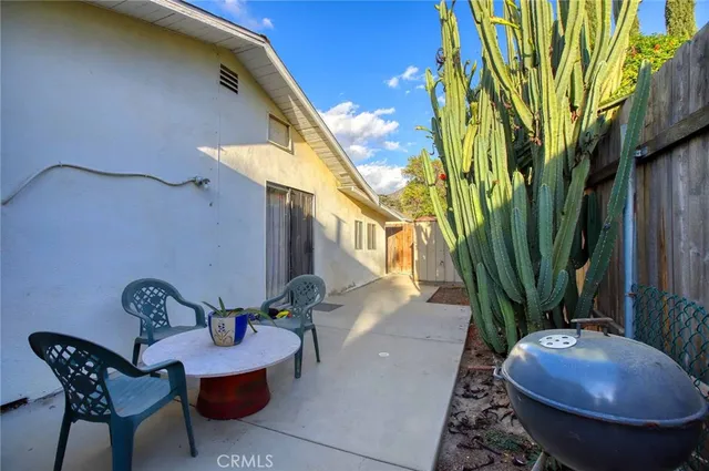 a bedroom with furniture and a large window