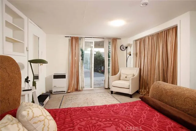 a view of a two chairs in the balcony