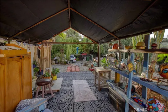 a view of a chairs and tables in the patio