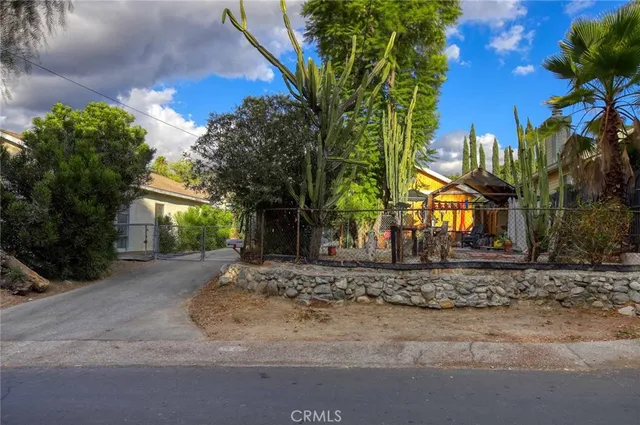 a view of a road with a building in the background