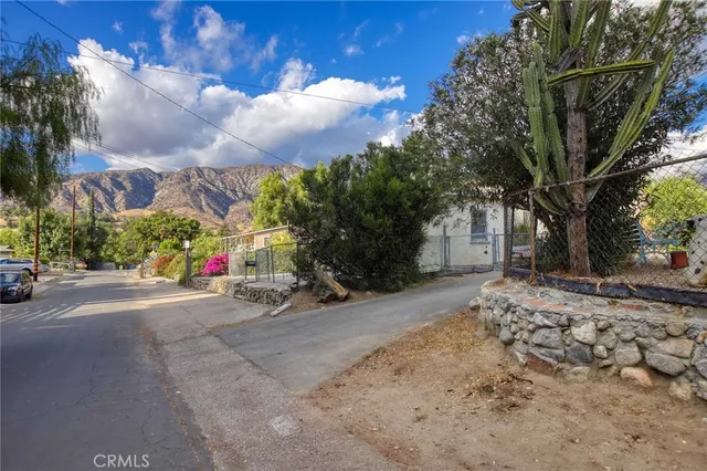 a view of house with yard