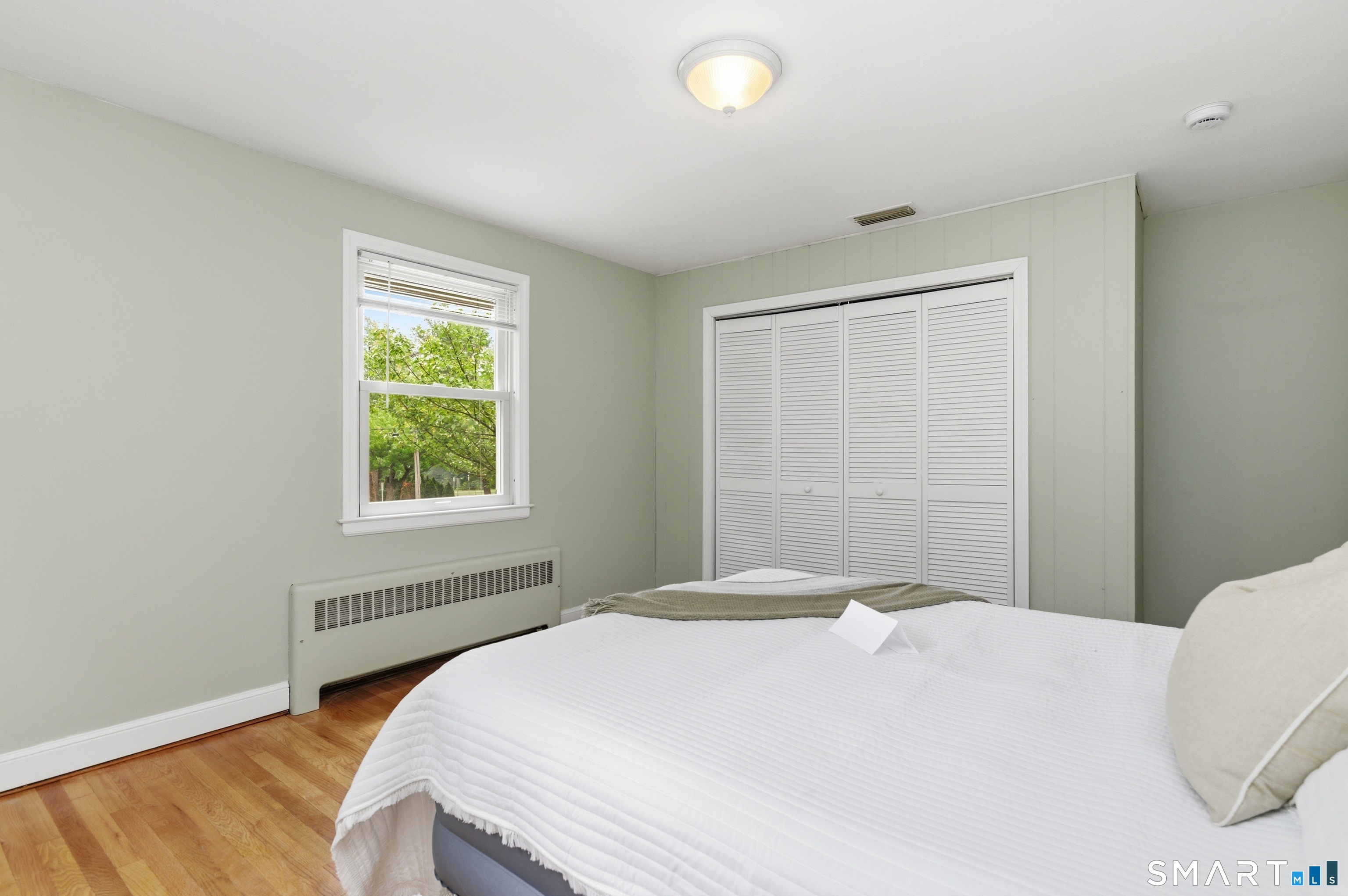149 Mill Street Wethersfield, CT 06109 - Photo 11 of 29 a bedroom with a bed and a window