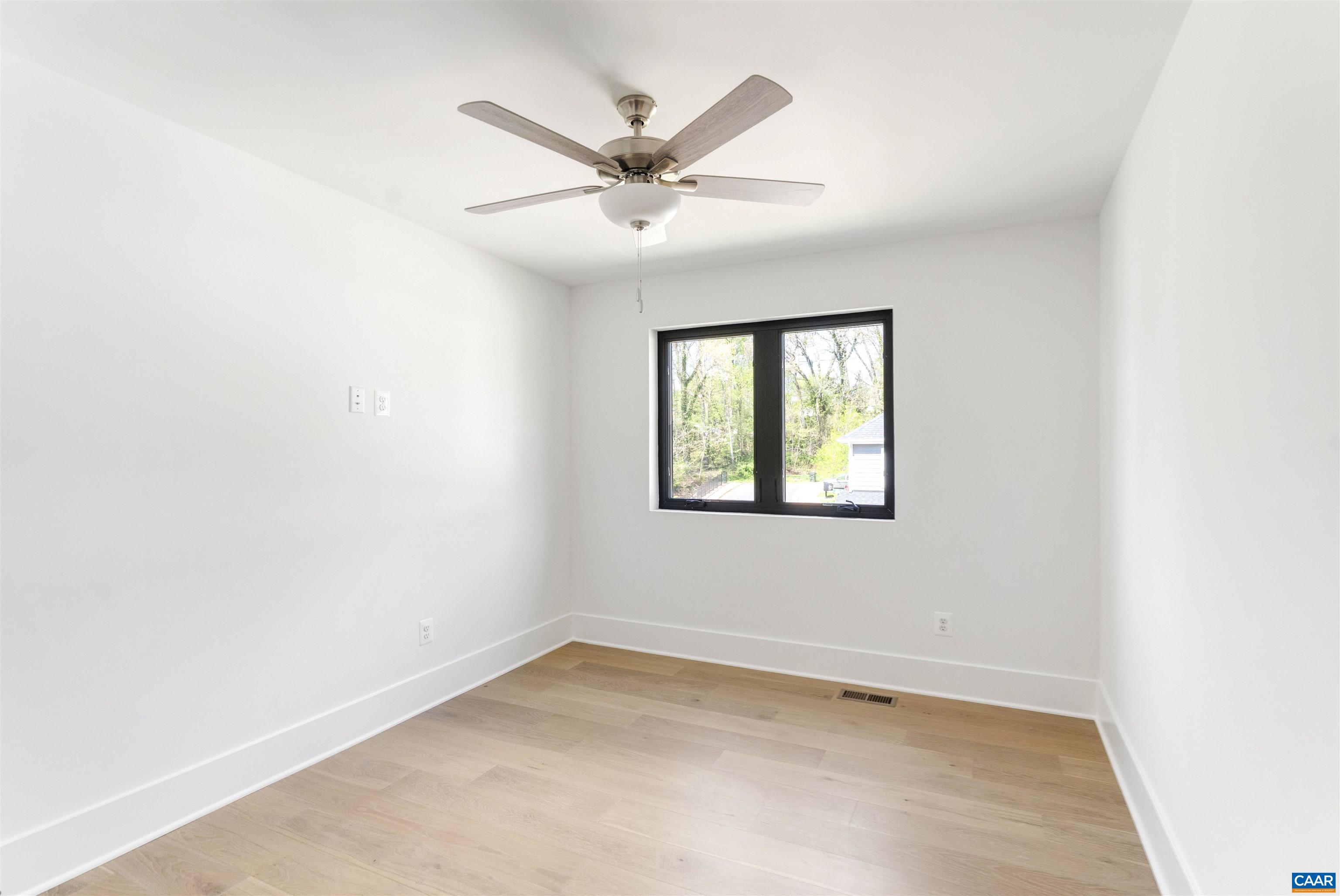983 5th Street Southwest Charlottesville, VA 22903 - Photo 21 of 33 an empty room with a window and a fan