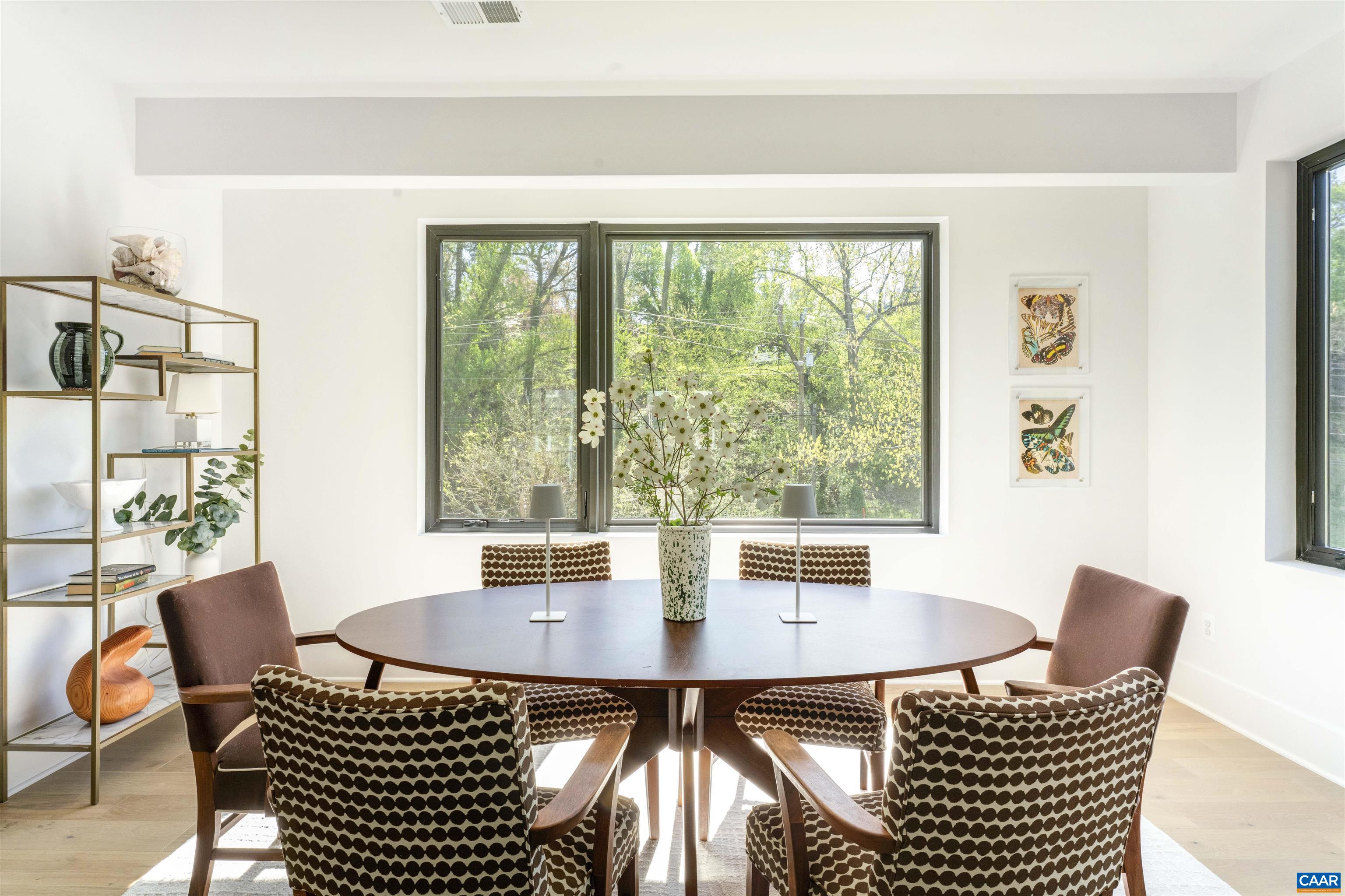 983 5th Street Southwest Charlottesville, VA 22903 - Photo 8 of 33 a view of a dining room with furniture and wooden floor